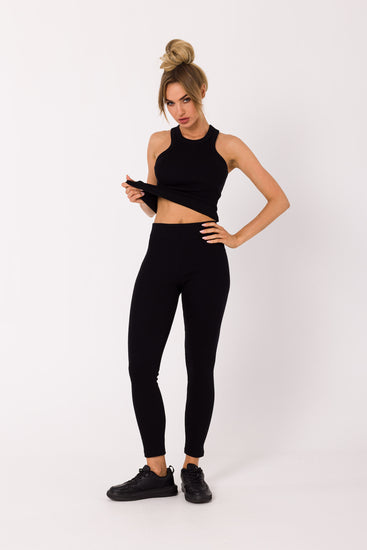 Upgrade your wardrobe with our Black Ribbed Knit Leggings. Crafted from high-quality ribbed knit fabric, these leggings can be worn as a set with our matching tank top or mixed and matched for various chic outfits. Perfect for loungewear, working from home, sports, and running errands. Experience the comfort and style of this essential piece that adapts to your everyday fashion needs.