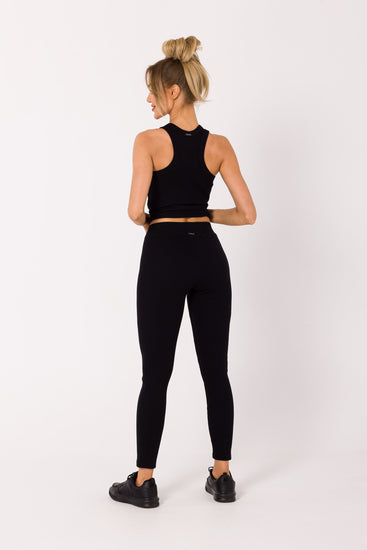 Upgrade your wardrobe with our Black Ribbed Knit Leggings. Crafted from high-quality ribbed knit fabric, these leggings can be worn as a set with our matching tank top or mixed and matched for various chic outfits. Perfect for loungewear, working from home, sports, and running errands. Experience the comfort and style of this essential piece that adapts to your everyday fashion needs.