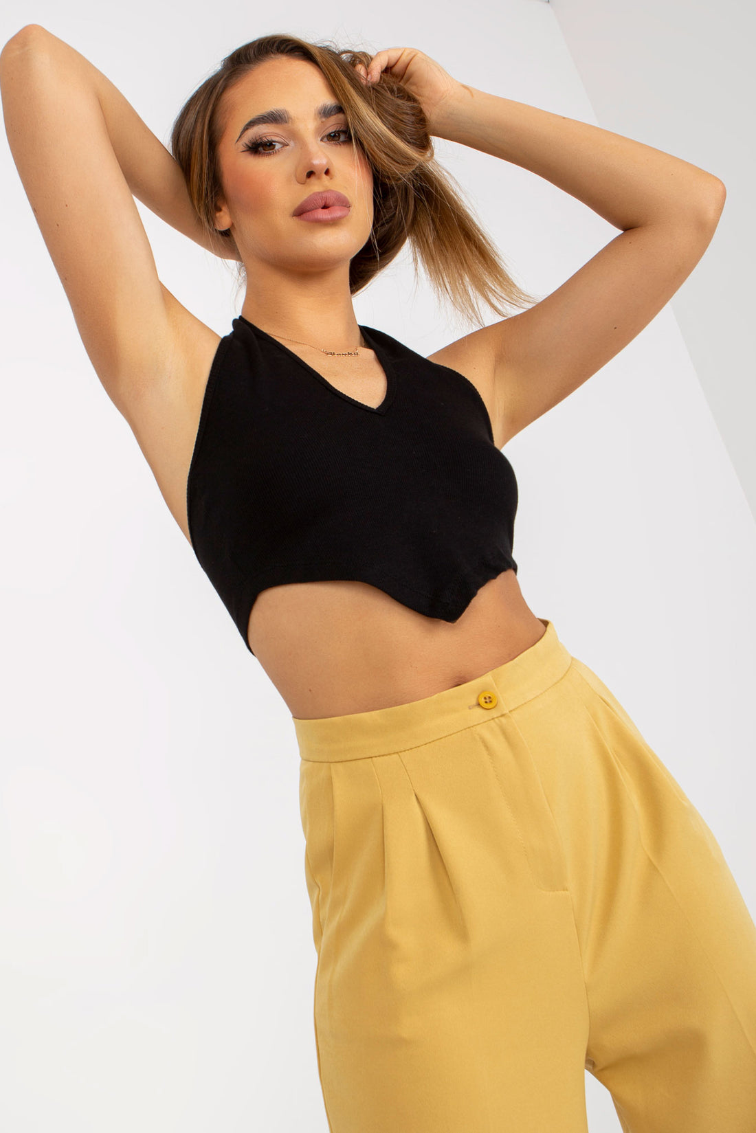 Discover contemporary style with our Butter Color Wide Leg Pleated Trousers. These trendy trousers boast a wide-leg design and classic pleats, offering a timeless yet modern look. The unique butter color adds a distinctive touch, making them versatile for any occasion. Explore your fashion options today.