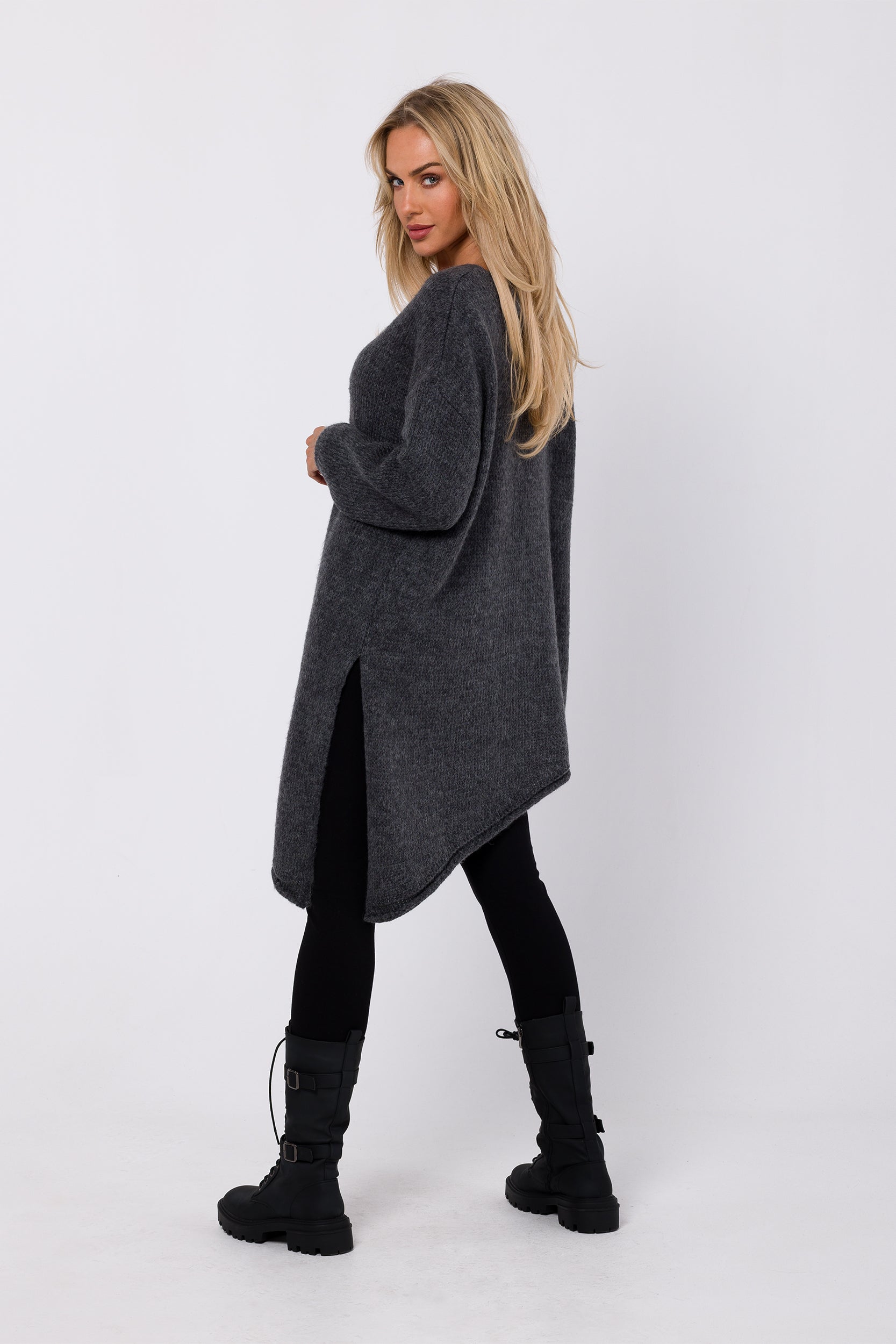 Experience the perfect blend of comfort and style with our Relaxed Fit Sweater Asymmetric. Crafted from an open chunky knit, it boasts a relaxed fit with an asymmetric bottom hem and side split for modern flair. The long sleeves and deep V-shaped neckline add warmth and allure. This versatile piece can be worn as a classic pullover or transformed into a one-shoulder statement, making it a must-have for your winter wardrobe.