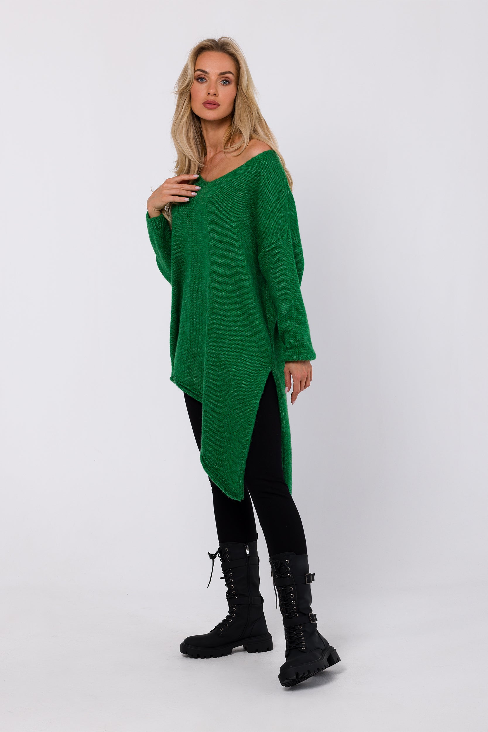Experience the perfect blend of comfort and style with our Relaxed Fit Sweater Asymmetric. Crafted from open chunky knit, it boasts a relaxed fit with an asymmetric bottom hem and side split for modern flair. The long sleeves and deep V-shaped neckline add warmth and allure. This versatile piece can be worn as a classic pullover or transformed into a one-shoulder statement, making it a must-have for your winter wardrobe.