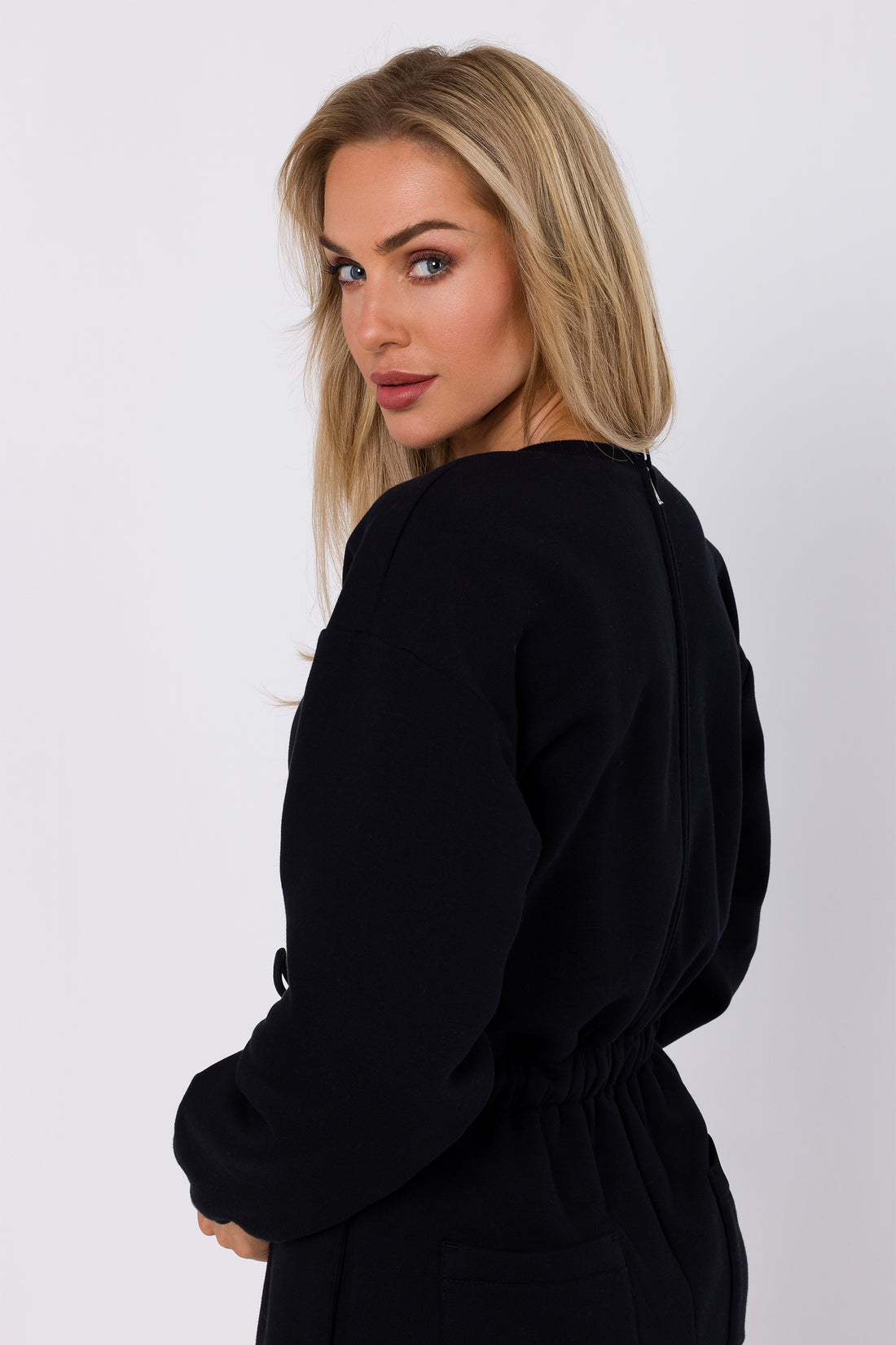 One-Piece Sweatshirt Jumpsuit | Strictly In | Embrace casual chic with our knit one-piece jumpsuit. Long sleeves, elasticated waist, and practical pockets make it your go-to for easy, stylish comfort.