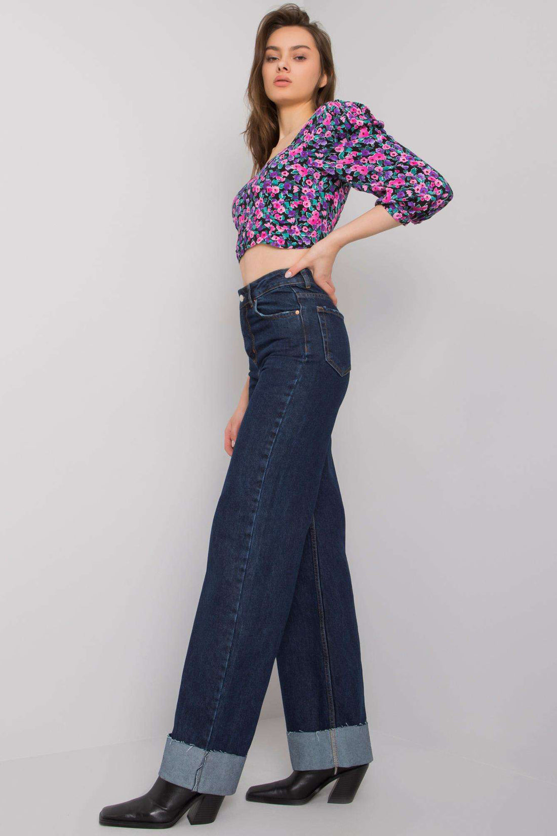 Explore the latest trend with our Turned-Up Cuffs Wide-Leg Jeans. These jeans offer a contemporary twist with stylish turned-up cuffs, combining fashion and comfort effortlessly. Elevate your wardrobe with this trendy addition today.