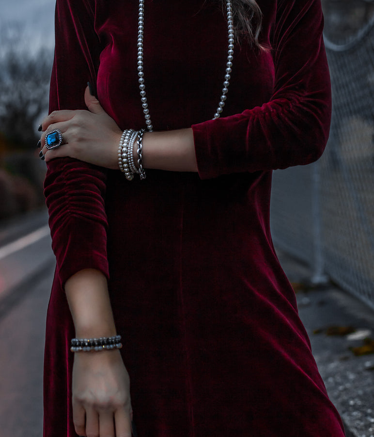 Buy Velvet Dresses - woman wearing red velvet dress with pearls