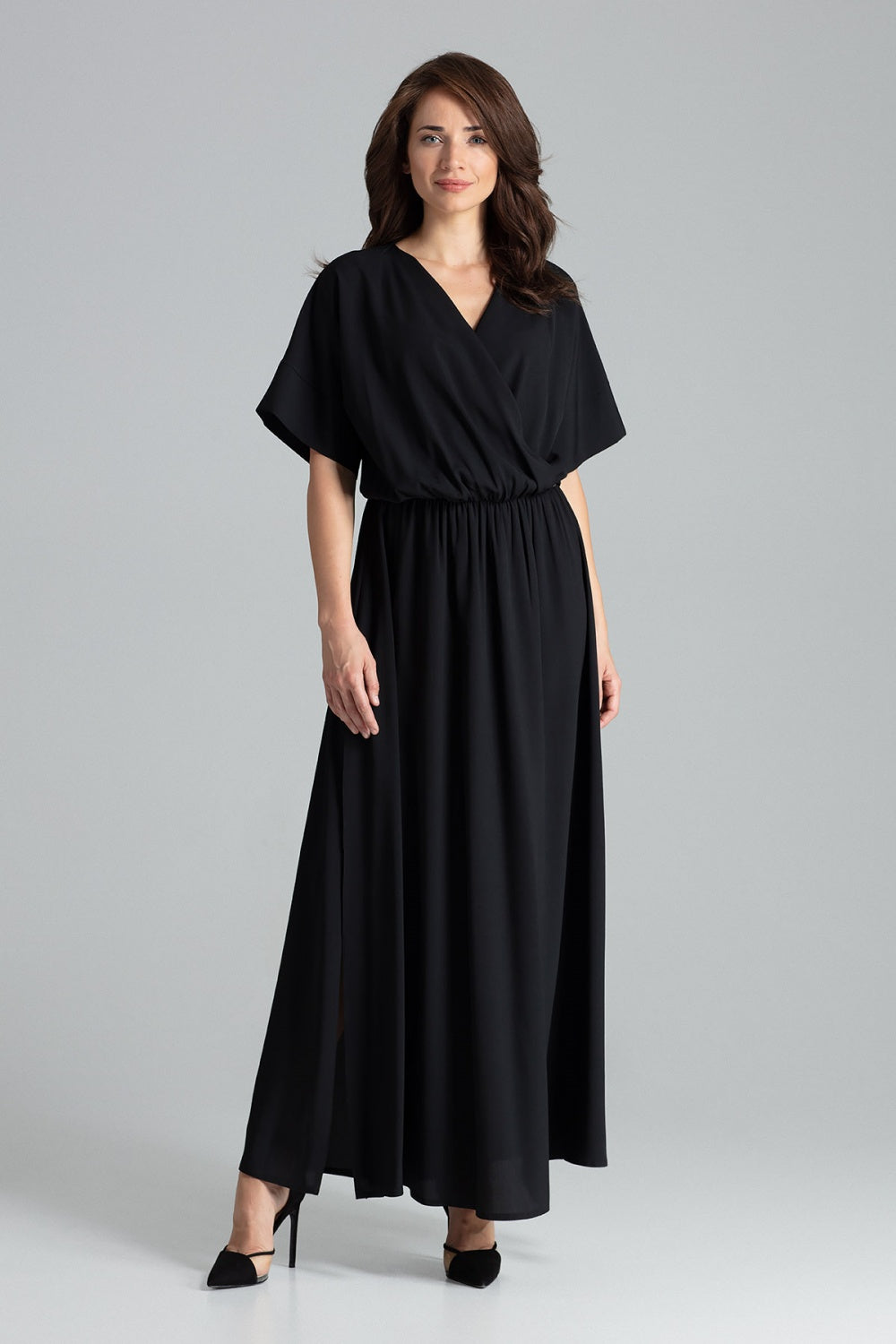 Black long dress with short kimono sleeves, elastic waistband, and side slits.